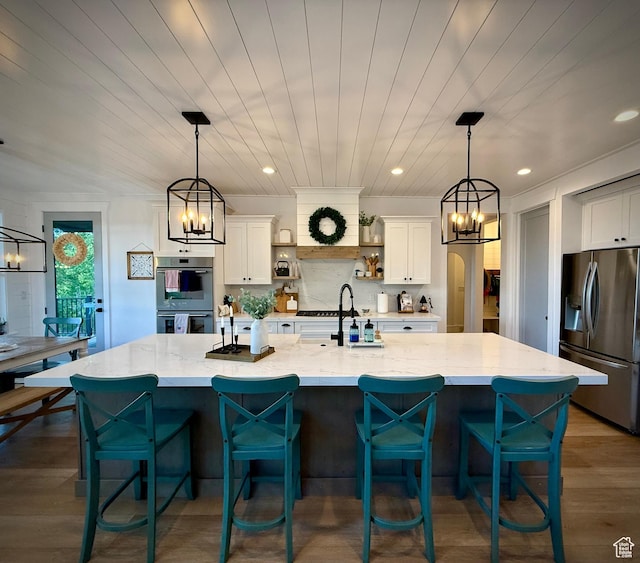 268 N 1400 W, Midway, UT 84049 - kitchen featuring stainless steel fridge, a chandelier, a sink, white cabinets, and light stone countertops