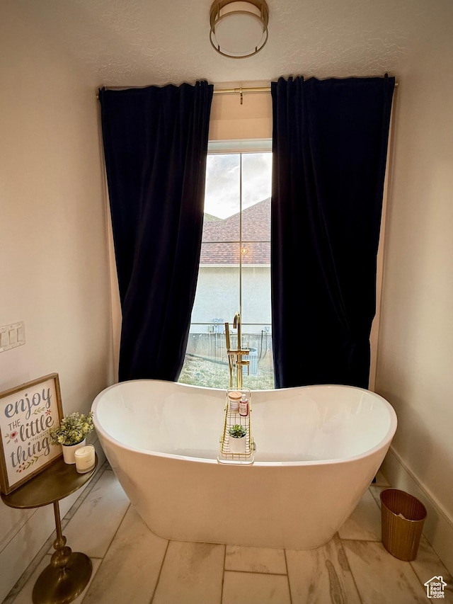 268 N 1400 W, Midway, UT 84049 - full bathroom featuring a freestanding bath, marble finish flooring, and baseboards