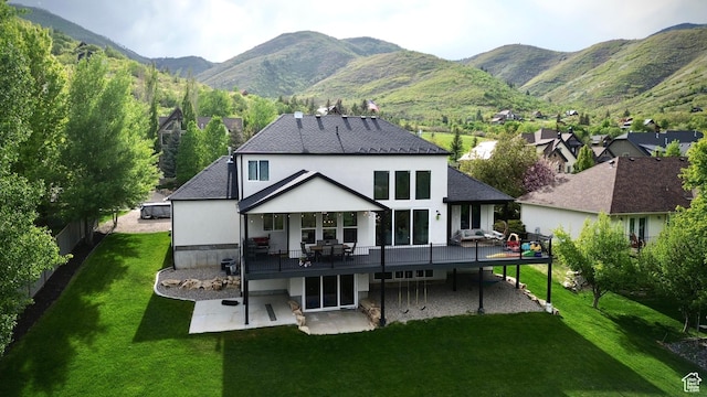 268 N 1400 W, Midway, UT 84049 - back of property with a deck with mountain view, a patio, a yard, and stucco siding