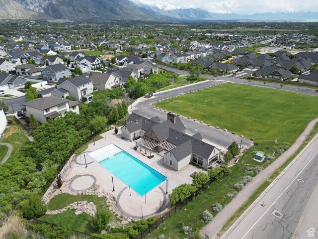 12137 N Montrose Dr, Highland, UT 84003 - aerial view of residential area with a pool and a mountain backdrop