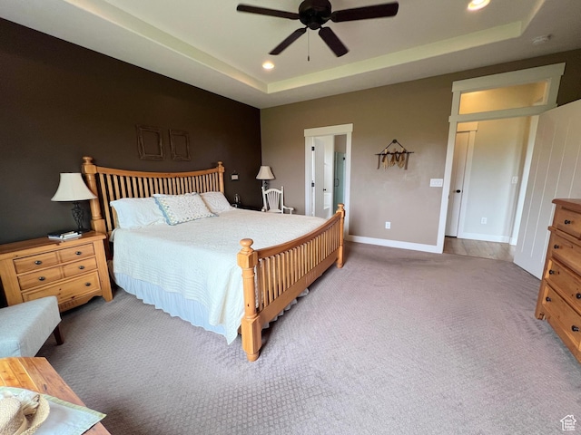 12137 N Montrose Dr, Highland, UT 84003 - bedroom featuring carpet, a raised ceiling, recessed lighting, baseboards, and a ceiling fan