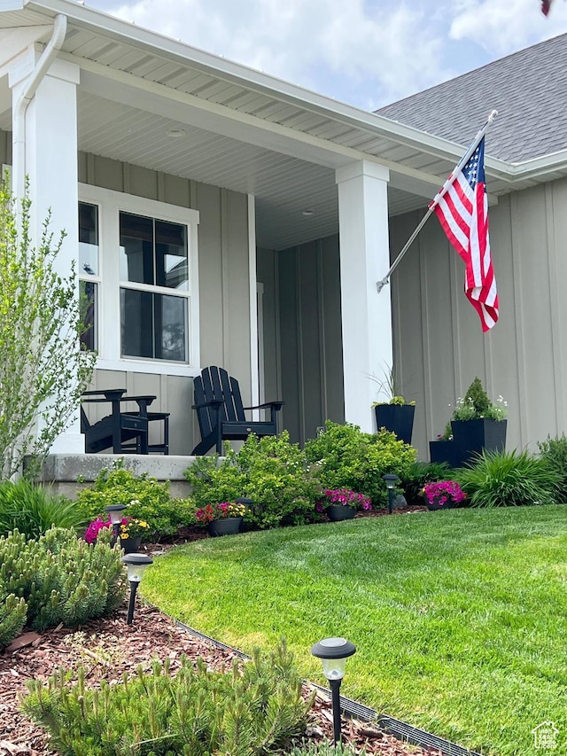 12137 N Montrose Dr, Highland, UT 84003 - entrance to property featuring board and batten siding, a yard, and a porch