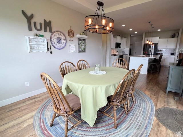 12137 N Montrose Dr, Highland, UT 84003 - dining room with a chandelier, light wood-type flooring, baseboards, and recessed lighting