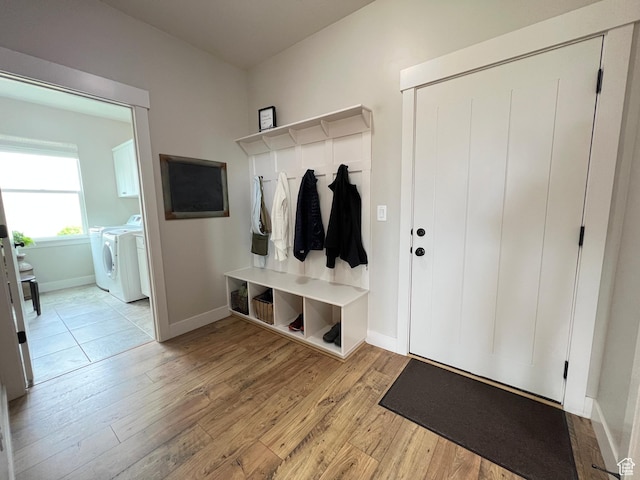 12137 N Montrose Dr, Highland, UT 84003 - mudroom with separate washer and dryer, wood finished floors, and baseboards
