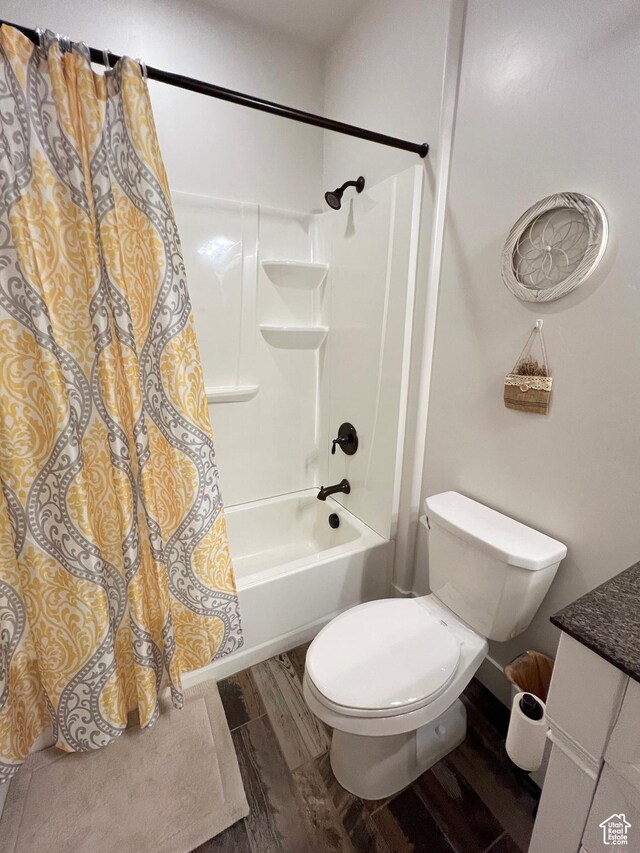 12137 N Montrose Dr, Highland, UT 84003 - bathroom with wood finished floors, shower / bath combination with curtain, vanity, and toilet