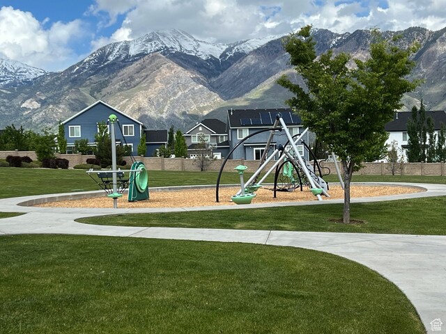 12137 N Montrose Dr, Highland, UT 84003 - community jungle gym with a mountain view and a yard