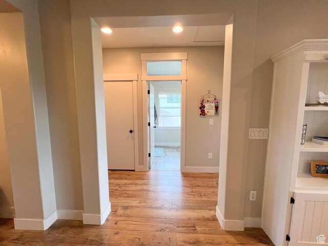 12137 N Montrose Dr, Highland, UT 84003 - hallway featuring light wood-style floors, baseboards, and recessed lighting