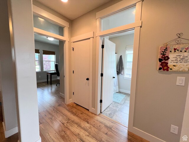 12137 N Montrose Dr, Highland, UT 84003 - corridor featuring light wood-style floors and baseboards