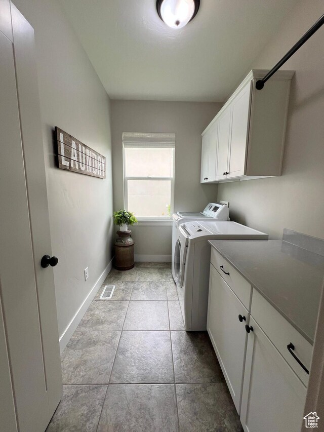 12137 N Montrose Dr, Highland, UT 84003 - washroom with washing machine and dryer, cabinet space, baseboards, and tile patterned floors