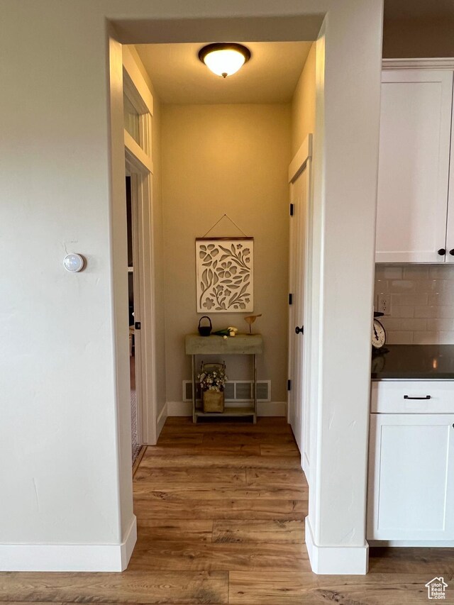 12137 N Montrose Dr, Highland, UT 84003 - corridor with light wood-style floors and baseboards