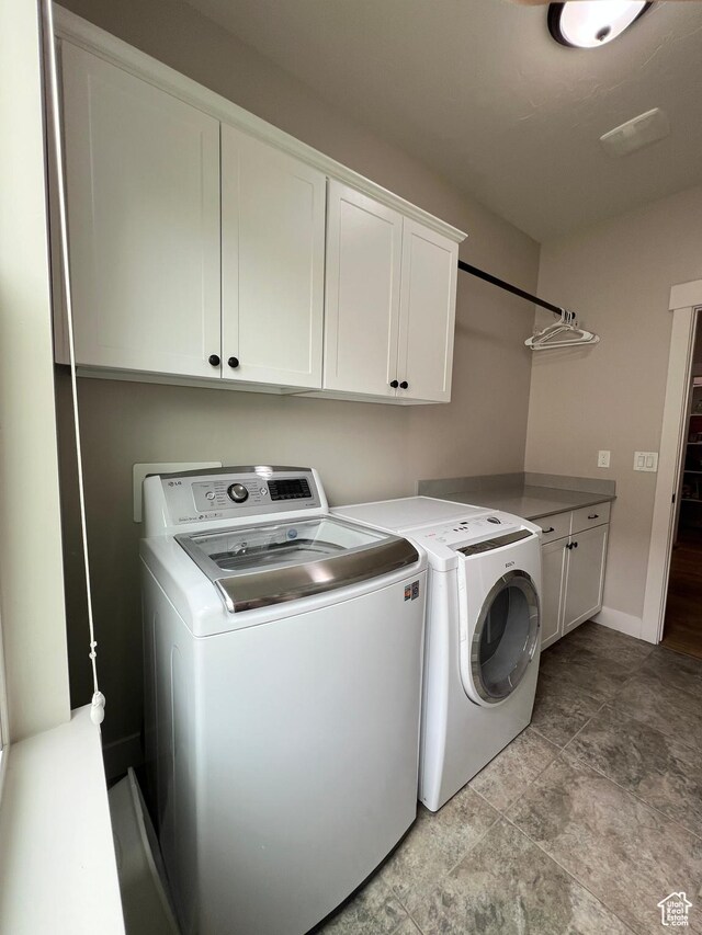 12137 N Montrose Dr, Highland, UT 84003 - laundry room with separate washer and dryer, cabinet space, and baseboards