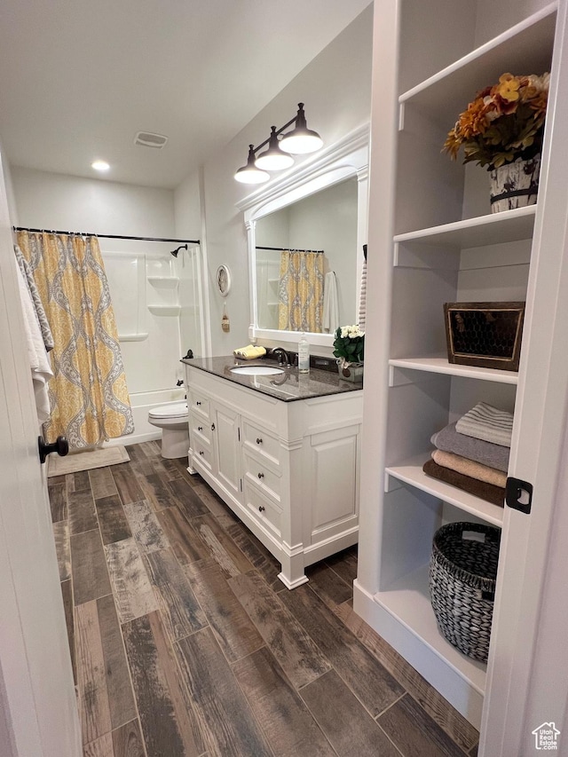 12137 N Montrose Dr, Highland, UT 84003 - bathroom featuring wood finished floors, vanity, shower / tub combo, toilet, and recessed lighting