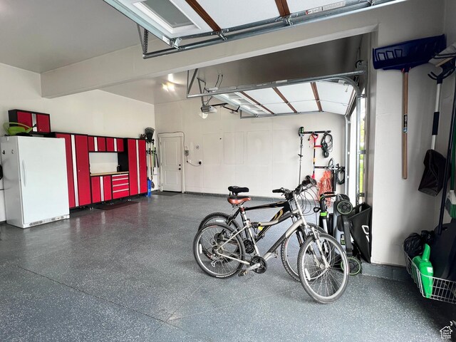 12137 N Montrose Dr, Highland, UT 84003 - garage with freestanding refrigerator and a garage door opener