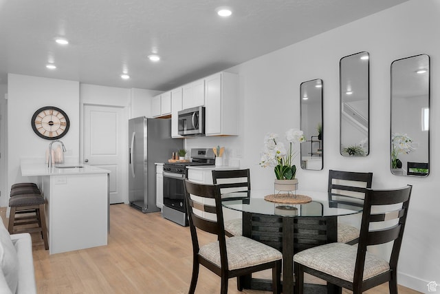 122 N Seaside St Unit 2319, Saratoga Springs, UT 84045 - dining room with light wood finished floors and recessed lighting