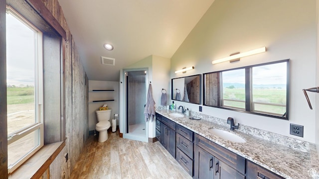 1164 S 1600 E, Preston, ID 83263 - full bath with double vanity, wood finished floors, lofted ceiling, toilet, and a shower