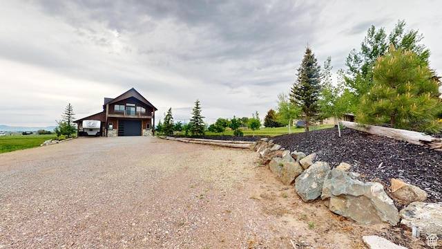 1164 S 1600 E, Preston, ID 83263 - view of front of home featuring an attached garage and gravel driveway