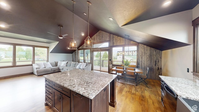 1164 S 1600 E, Preston, ID 83263 - kitchen with a ceiling fan, light wood finished floors, dishwashing machine, light stone countertops, and high vaulted ceiling