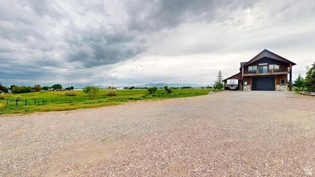 1164 S 1600 E, Preston, ID 83263 - view of front facade with driveway, a garage, and stone siding