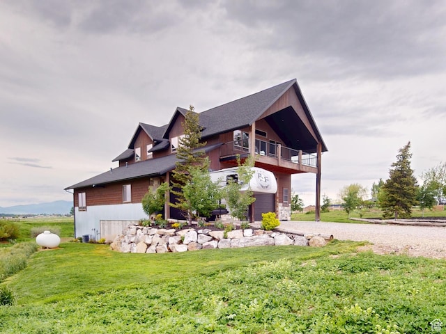1164 S 1600 E, Preston, ID 83263 - view of side of home featuring a balcony, driveway, a yard, and a garage