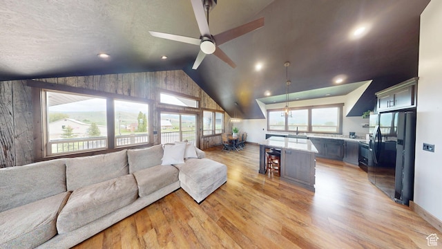 1164 S 1600 E, Preston, ID 83263 - living room with lofted ceiling, light wood-type flooring, ceiling fan, and recessed lighting