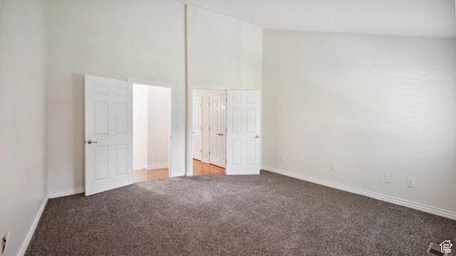 3263 Shadowbrook Cir N, Provo, UT 84604 - unfurnished bedroom with light colored carpet, a towering ceiling, and baseboards