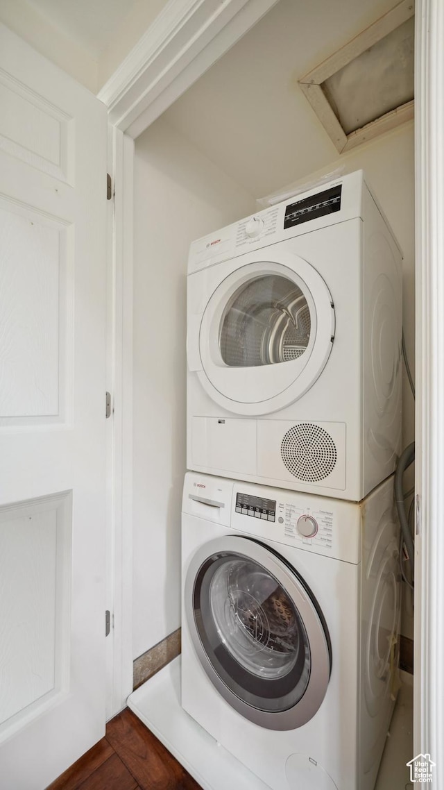 3263 Shadowbrook Cir N, Provo, UT 84604 - washroom with stacked washer / dryer and dark wood-style flooring