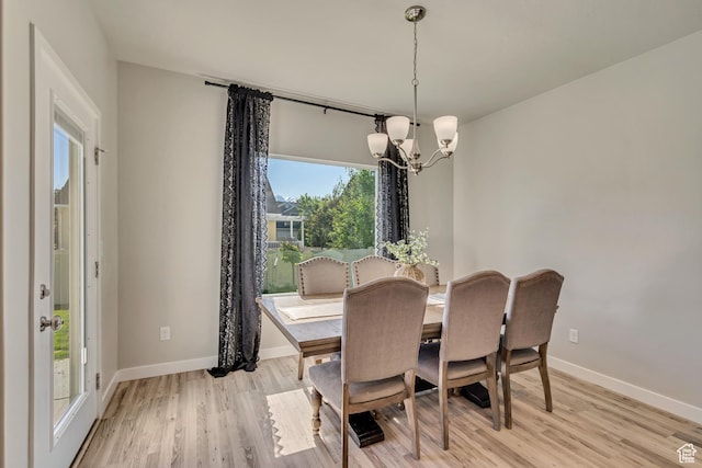 2466 S 2200 W, West Haven, UT 84401 - dining room with a chandelier, light wood-style flooring, and baseboards