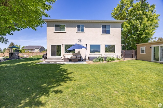 181 W 400 S, Hyrum, UT 84319 - back of property with stucco siding, outdoor lounge area, a patio area, and entry steps