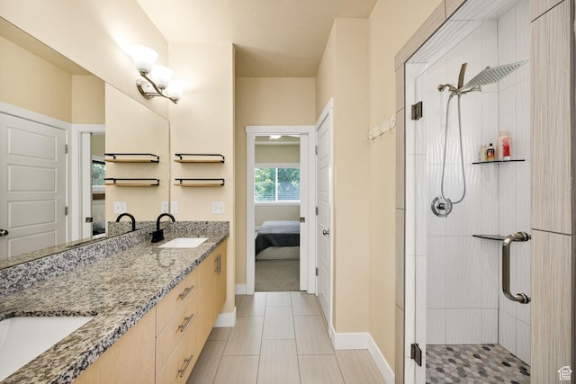 181 W 400 S, Hyrum, UT 84319 - bathroom featuring connected bathroom, double vanity, a stall shower, and baseboards