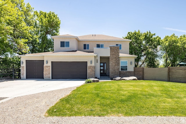 181 W 400 S, Hyrum, UT 84319 - view of front of house with stone siding, stucco siding, concrete driveway, and an attached garage