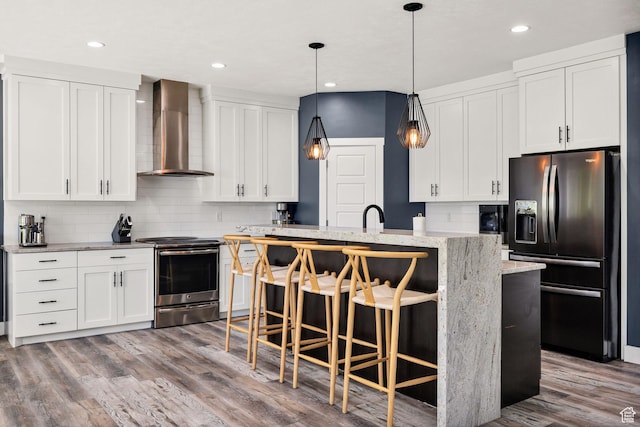 181 W 400 S, Hyrum, UT 84319 - kitchen with refrigerator with ice dispenser, wall chimney range hood, electric range, tasteful backsplash, and a kitchen island with sink