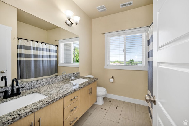 181 W 400 S, Hyrum, UT 84319 - full bathroom with toilet, baseboards, double vanity, and curtained shower