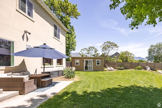 181 W 400 S, Hyrum, UT 84319 - view of yard with an outdoor structure, outdoor lounge area, a mountain view, and a patio