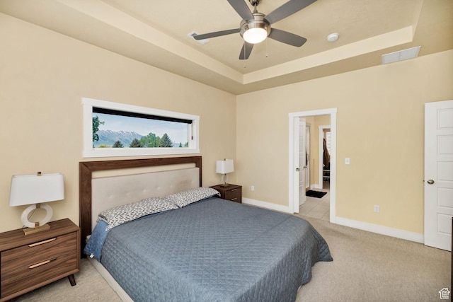 181 W 400 S, Hyrum, UT 84319 - bedroom featuring light colored carpet, baseboards, a tray ceiling, and ceiling fan