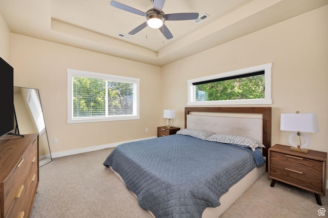 181 W 400 S, Hyrum, UT 84319 - bedroom with light colored carpet, a raised ceiling, baseboards, and ceiling fan