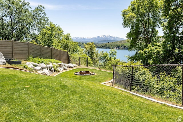 181 W 400 S, Hyrum, UT 84319 - view of yard with a water and mountain view and an outdoor fire pit