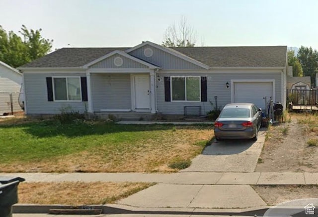 853 S 860 W, Tooele, UT 84074 - ranch-style house with concrete driveway, an attached garage, and a front lawn