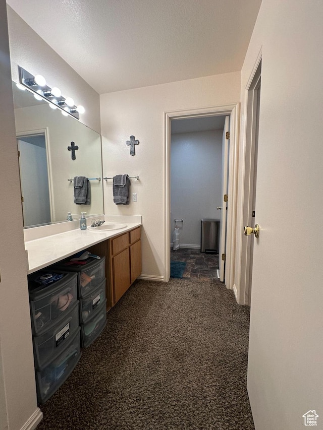 853 S 860 W, Tooele, UT 84074 - bathroom featuring vanity, baseboards, and carpet floors