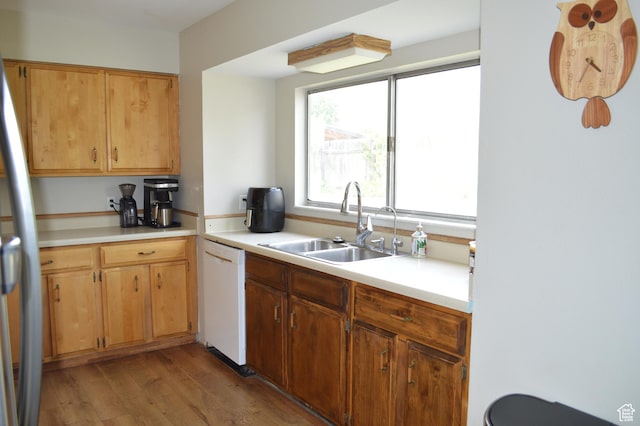 445 Valley View Dr, Pleasant Grove, UT 84062 - kitchen featuring white dishwasher, a sink, light wood finished floors, light countertops, and freestanding refrigerator