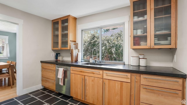 2504 S Dearborn St E, Salt Lake City, UT 84106 - kitchen featuring stainless steel dishwasher, a sink, healthy amount of natural light, and glass insert cabinets