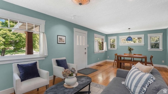 2504 S Dearborn St E, Salt Lake City, UT 84106 - living area featuring a textured ceiling, plenty of natural light, and baseboards