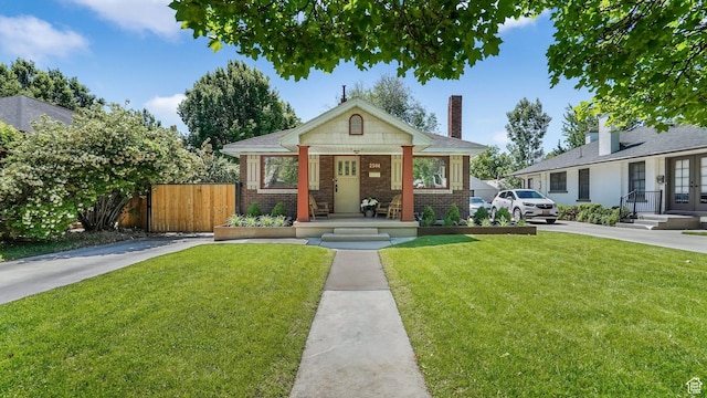 2504 S Dearborn St E, Salt Lake City, UT 84106 - bungalow with brick siding, french doors, and a chimney