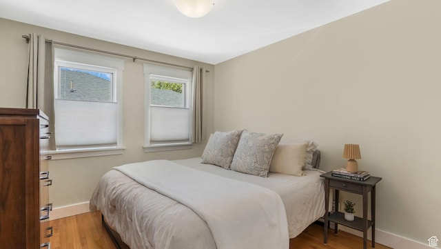 2504 S Dearborn St E, Salt Lake City, UT 84106 - bedroom with baseboards and wood finished floors