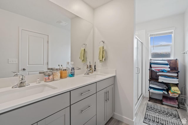 2092 N Red Yearling Dr, Saratoga Springs, UT 84045 - full bath with double vanity, a shower stall, wood finished floors, and baseboards