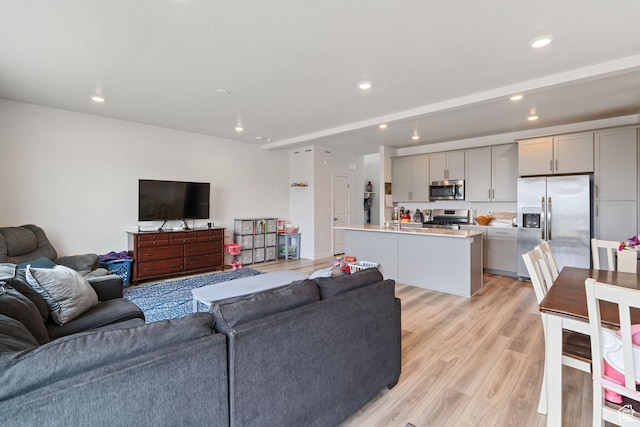 2092 N Red Yearling Dr, Saratoga Springs, UT 84045 - living room with light wood-type flooring and recessed lighting
