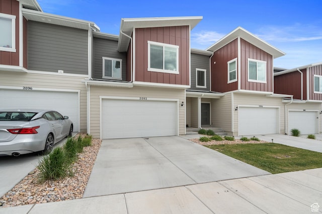 2092 N Red Yearling Dr, Saratoga Springs, UT 84045 - multi unit property featuring a garage, concrete driveway, and board and batten siding