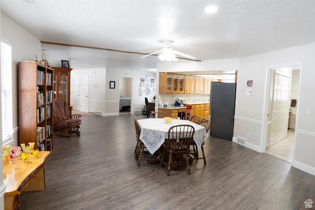 731 Pioneer Dr, Soda Springs, ID 83276 - dining space with a textured ceiling, wood finished floors, ceiling fan, and baseboards