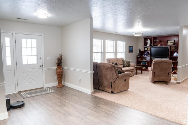 731 Pioneer Dr, Soda Springs, ID 83276 - foyer entrance featuring a textured ceiling, wood finished floors, and baseboards