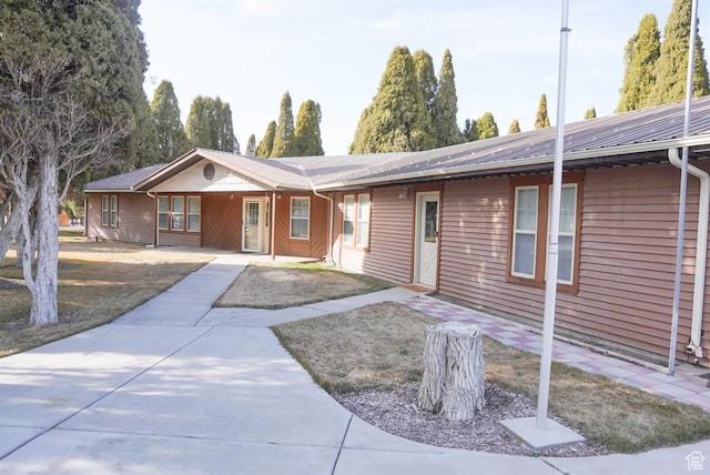 731 Pioneer Dr, Soda Springs, ID 83276 - ranch-style house featuring metal roof and a porch