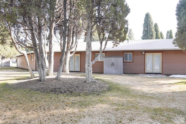 731 Pioneer Dr, Soda Springs, ID 83276 - ranch-style house featuring french doors, metal roof, and a front yard